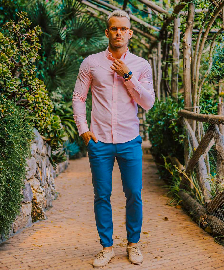 Wear a pink dress shirt, blue slim fit chinos, and beige derby shoes