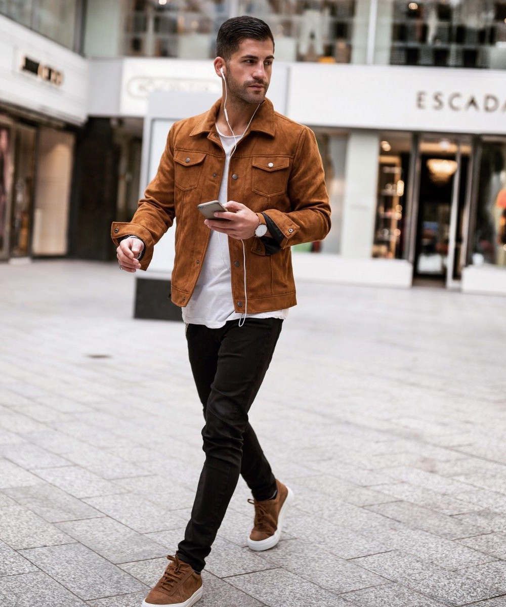 Brown suede jacket, white shirt, black pants, and brown sneakers