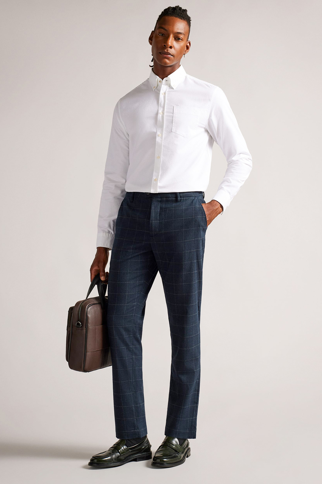 White button-down shirt, navy check dress pants, and black penny loafers outfit