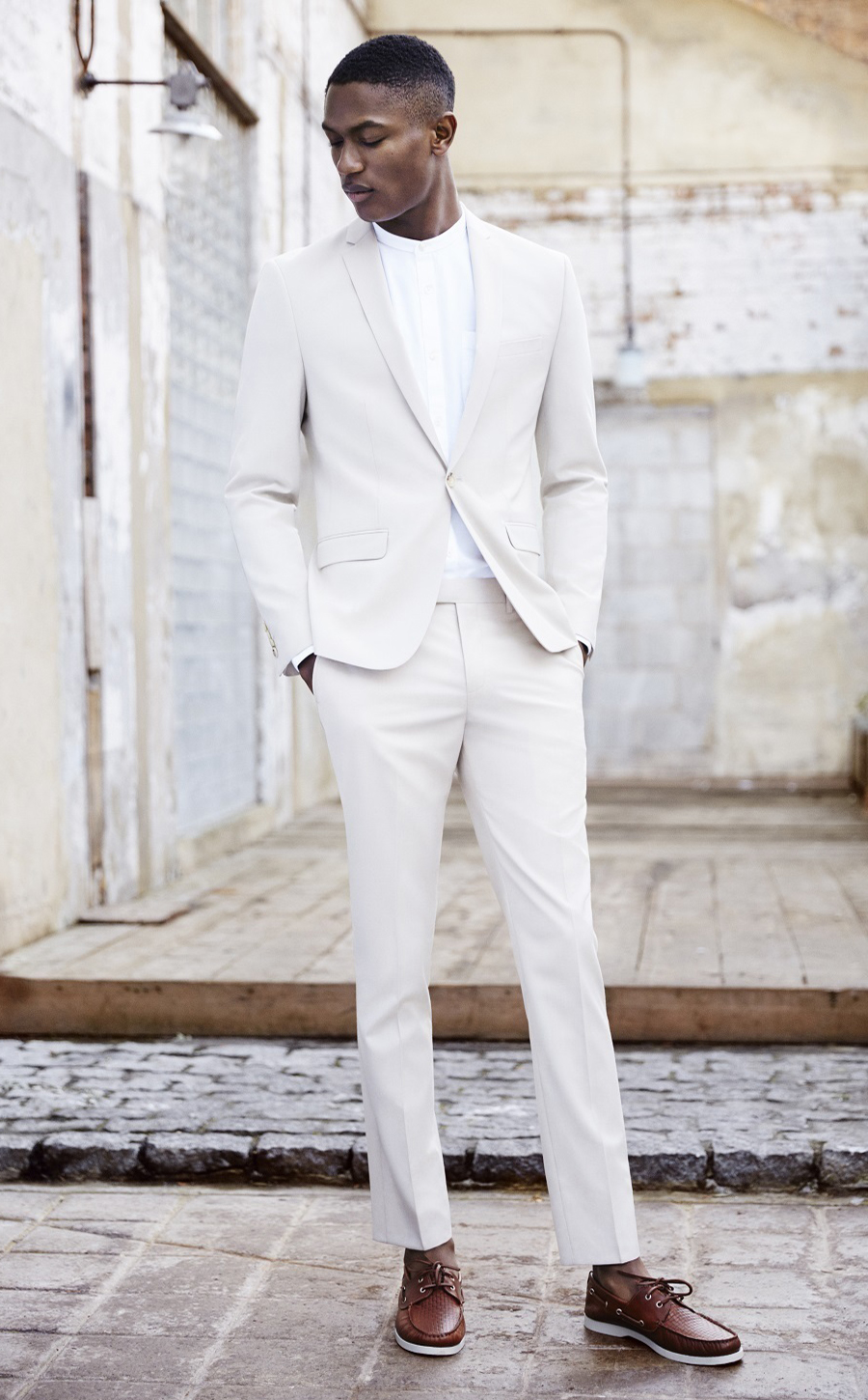 White suit, white long sleeve shirt, and brown leather boat shoes outfit