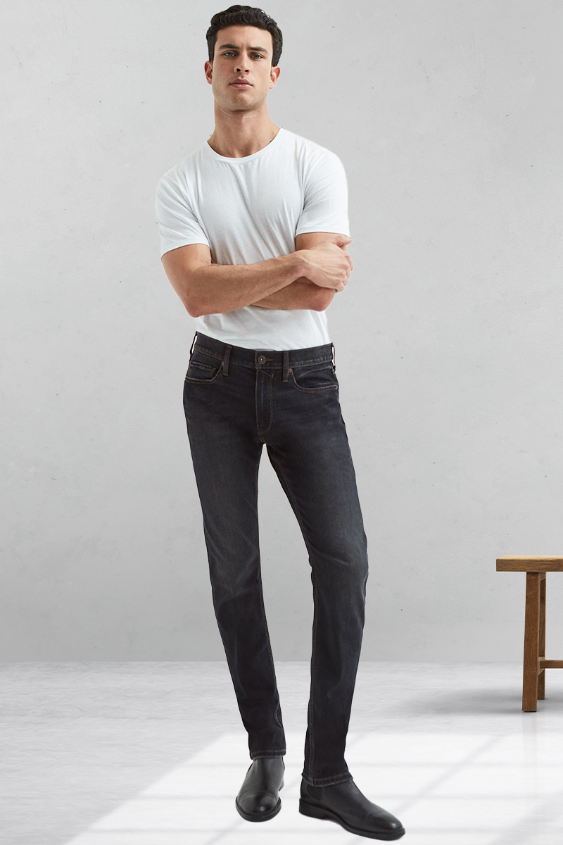 White t-shirt, charcoal jeans, and black leather Chelsea boots outfit