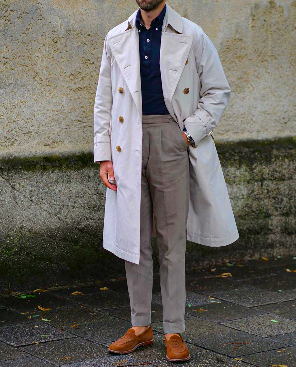 White trenchcoat, navy polo neck sweater, gray dress pants, brown suede loafers outfit